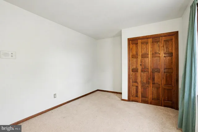 a view of a chair and tables on the roof deck