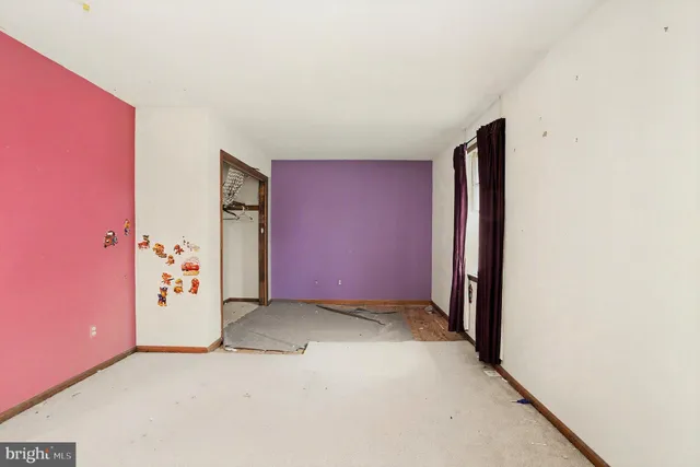 an empty room with painted walls