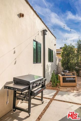 a view of a terrace with sitting area