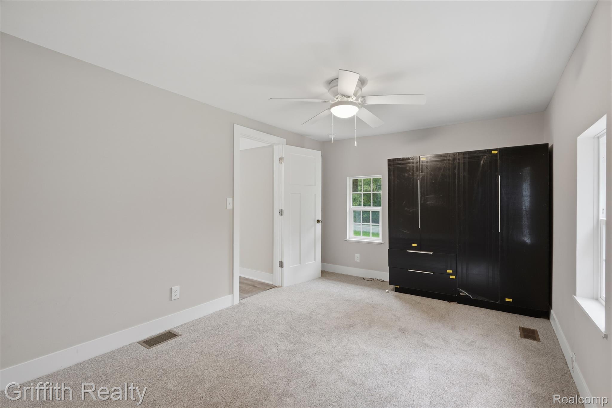 5820 Mack Road Howell, MI 48855 - Photo 22 of 60 Recessed window, ceiling-mounted fan, and light gray wall paint