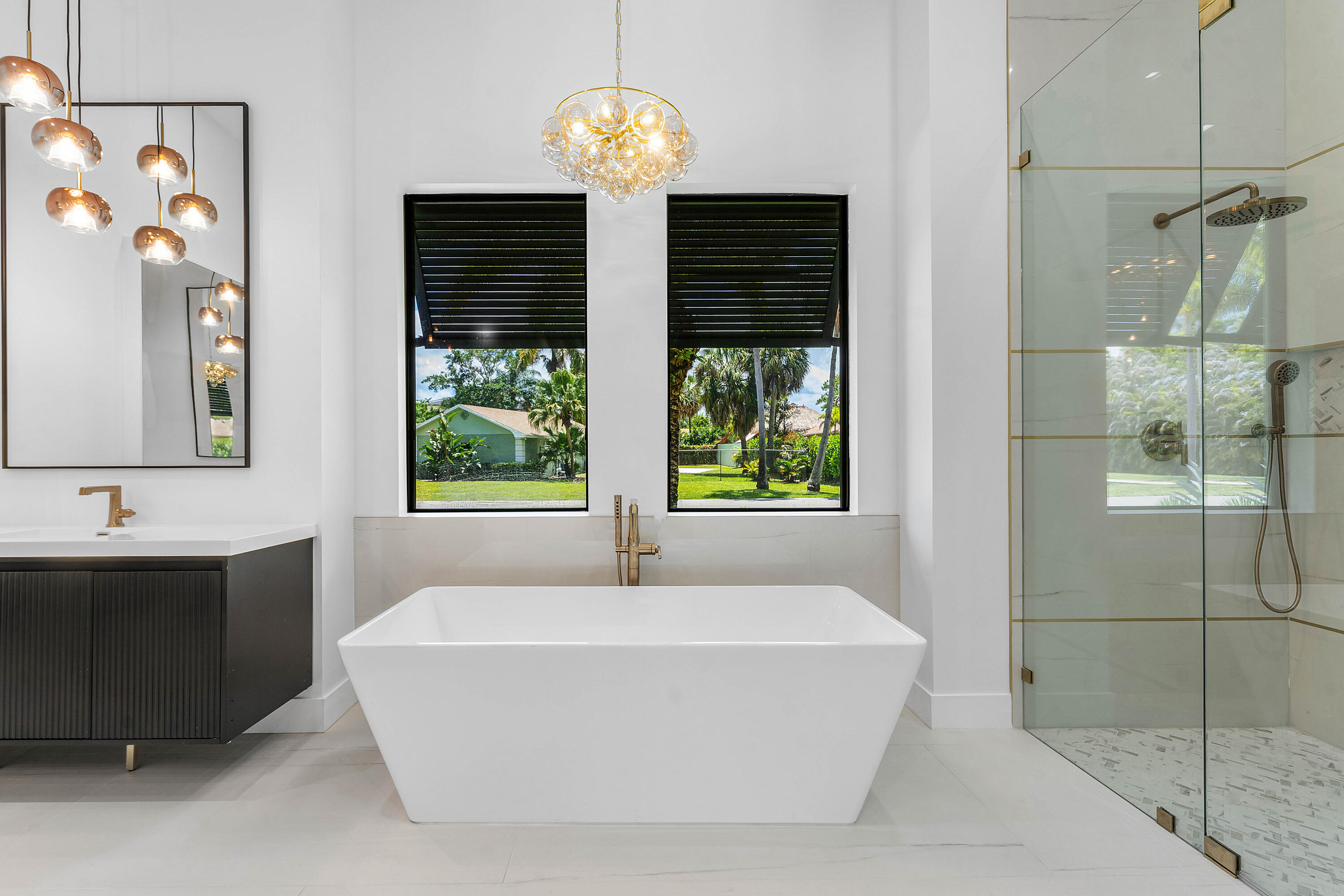 5701 Old Orange Road Jupiter, FL 33458 - Photo 22 of 46 a bathroom with a bathtub and a shower
