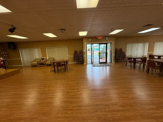a lobby with furniture and a large window