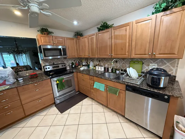 a kitchen with a stove and a microwave