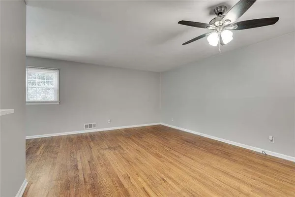 a kitchen with cabinets appliances a sink and a window