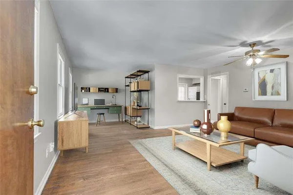 a living room with furniture and a window