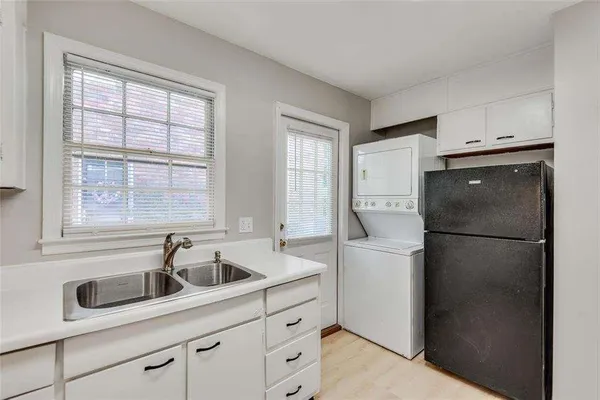 a bathroom with a sink a toilet and shower curtain