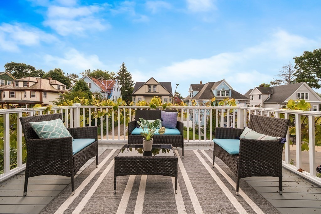 39 Rosedale Street Boston, MA 02124 - Photo 16 of 42 a view of a balcony with outdoor seating
