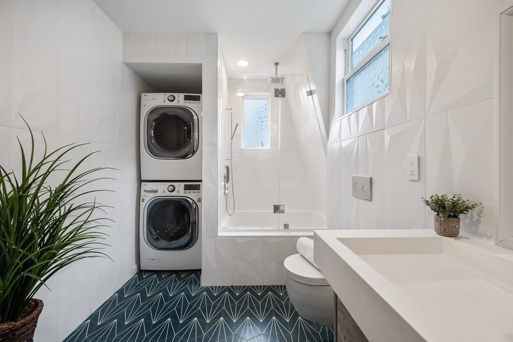 39 Rosedale Street Boston, MA 02124 - Photo 20 of 42 a bathroom with a sink a bathtub and a toilet