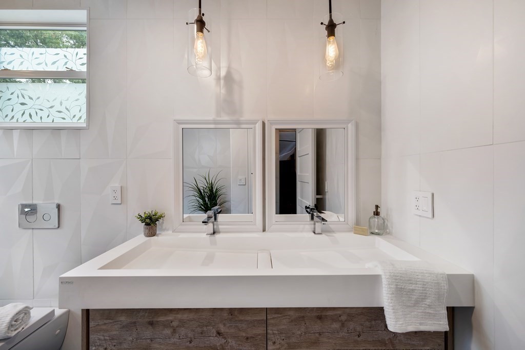 39 Rosedale Street Boston, MA 02124 - Photo 21 of 42 a bathroom with a sink and a mirror