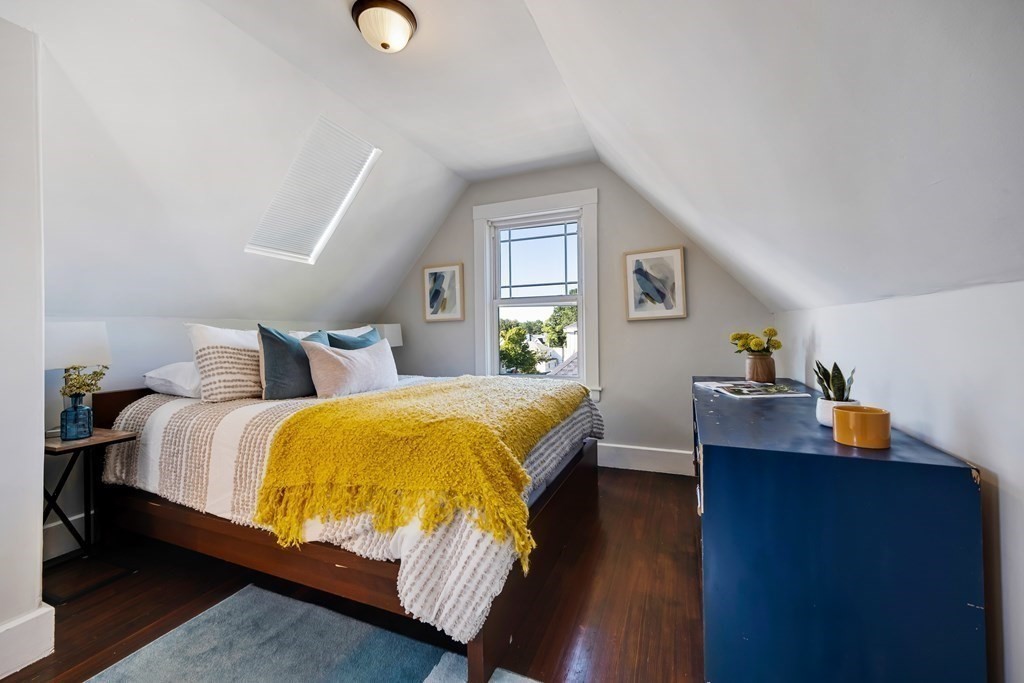 39 Rosedale Street Boston, MA 02124 - Photo 24 of 42 a bedroom with a bed and a dresser