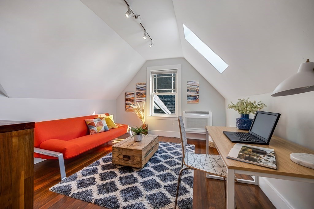 39 Rosedale Street Boston, MA 02124 - Photo 25 of 42 a living room with furniture a rug and a window
