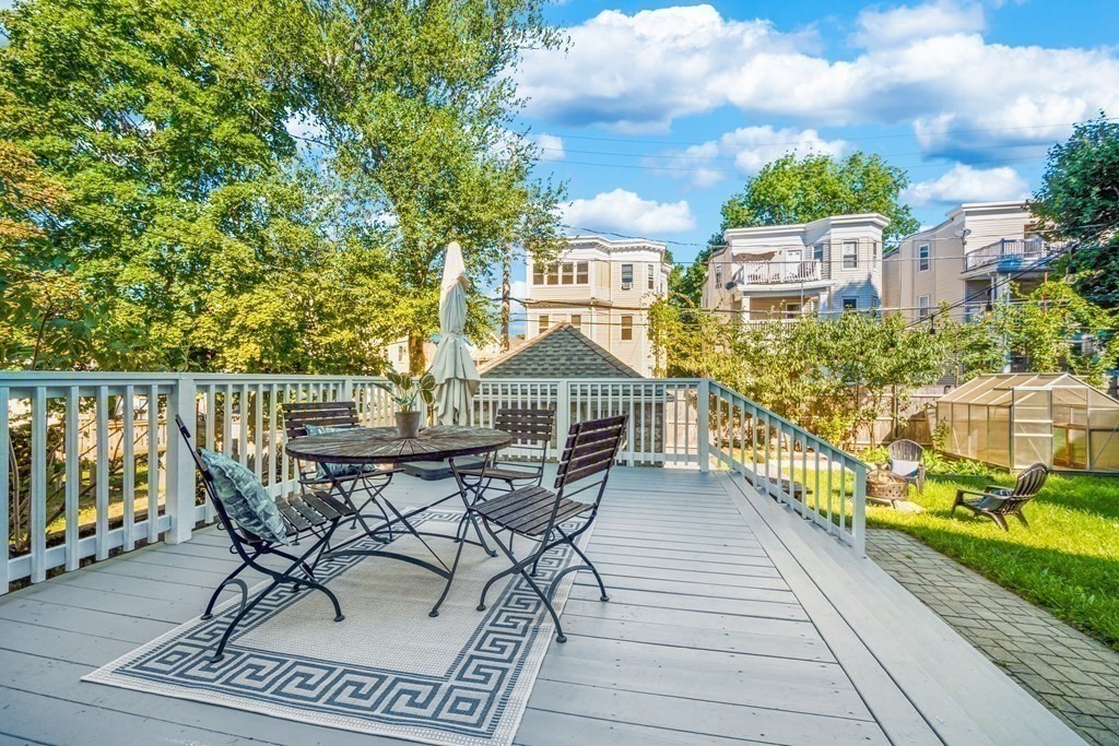 39 Rosedale Street Boston, MA 02124 - Photo 28 of 42 a view of a chairs and table on the terrace