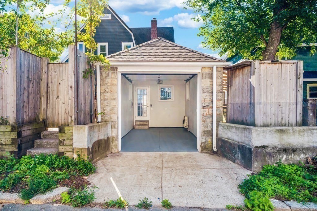 39 Rosedale Street Boston, MA 02124 - Photo 29 of 42 a front view of a house with a garden