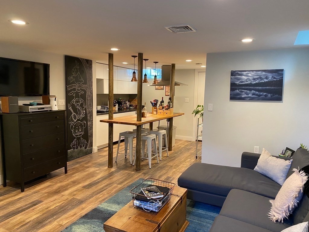 39 Rosedale Street Boston, MA 02124 - Photo 33 of 42 a living room with furniture and a flat screen tv