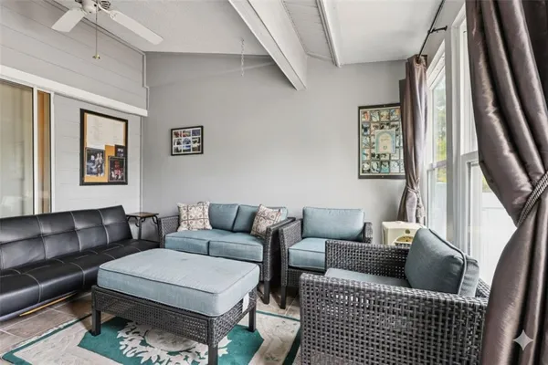 a living room with furniture and a rug