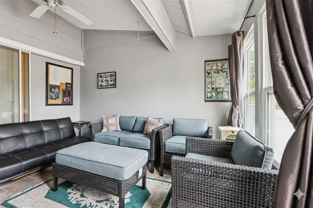 a living room with furniture and a rug