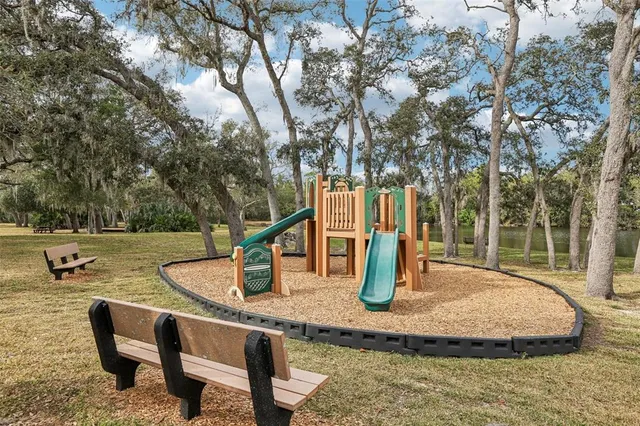 a view of a slide with sitting area