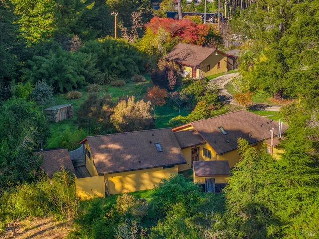 an aerial view of a house with a garden