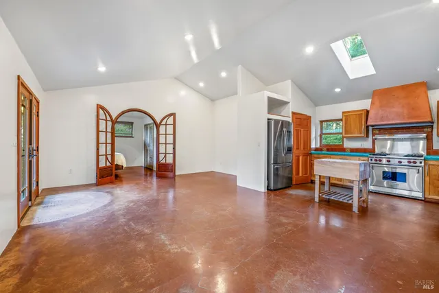 a view of a livingroom with furniture and a flat screen tv