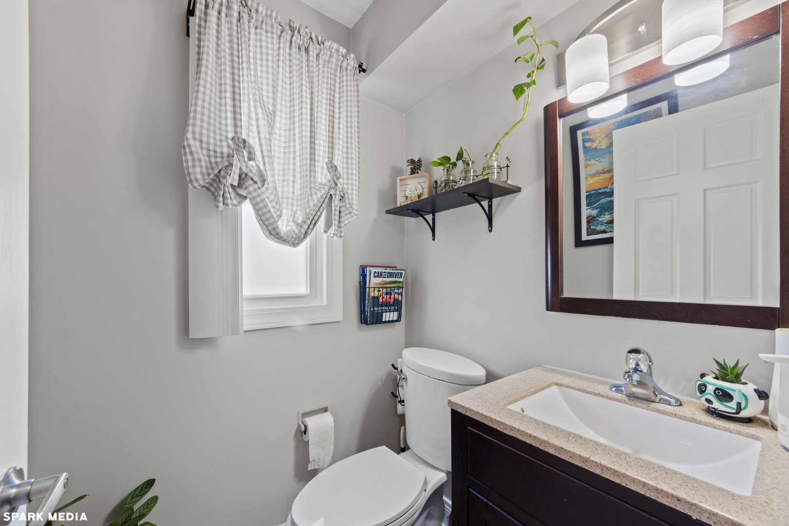 7612 Manchester Manor Hanover Park, IL 60133 - Photo 13 of 30 a bathroom with a sink vanity mirror and toilet