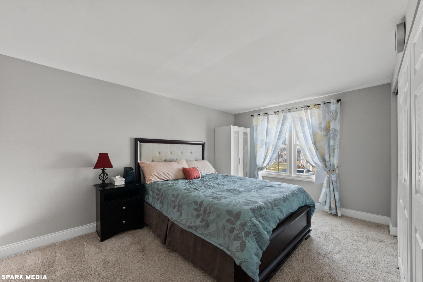 7612 Manchester Manor Hanover Park, IL 60133 - Photo 14 of 30 a bedroom with a bed and a window