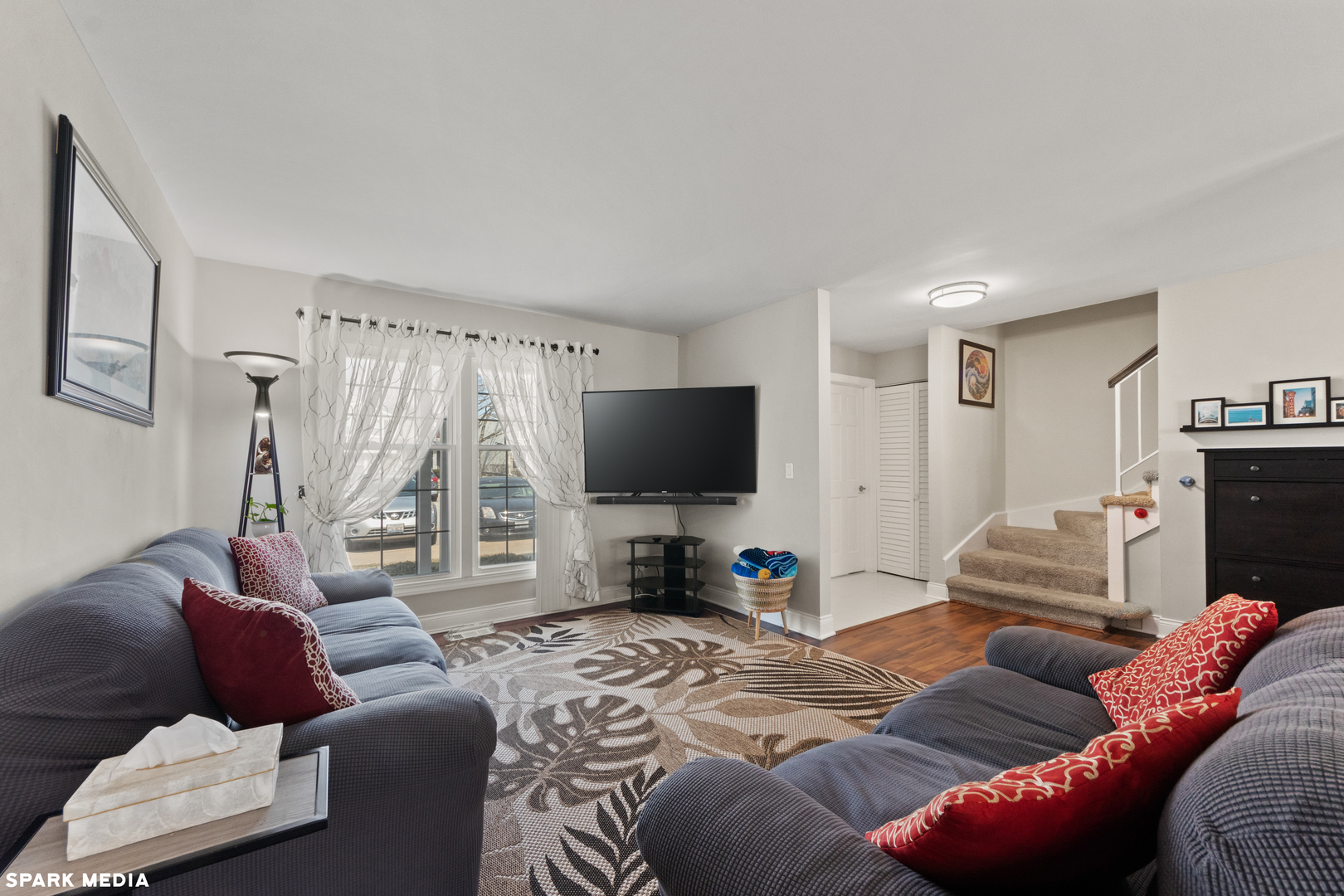 7612 Manchester Manor Hanover Park, IL 60133 - Photo 6 of 30 a living room with furniture and a flat screen tv