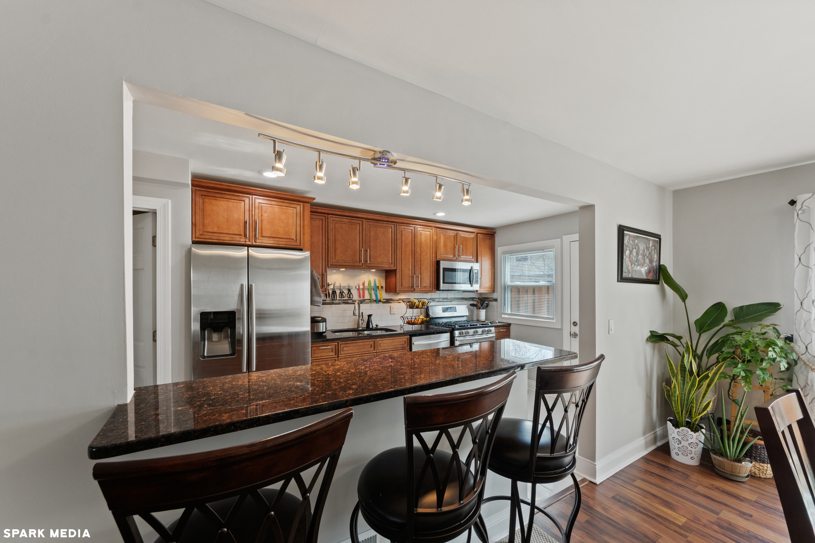 7612 Manchester Manor Hanover Park, IL 60133 - Photo 9 of 30 a kitchen with a table and chairs in it