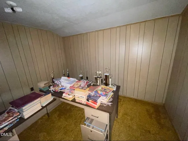 a bed room with a bed and furniture