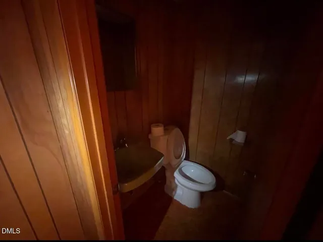 a bathroom with a toilet and a sink