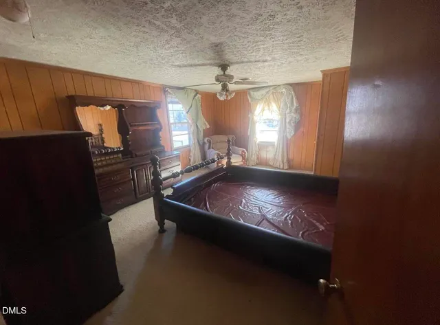 a room with pool table and windows