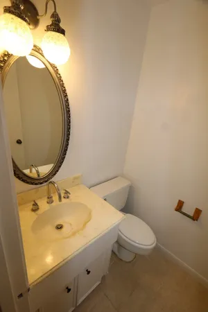 a bathroom with a sink and mirror