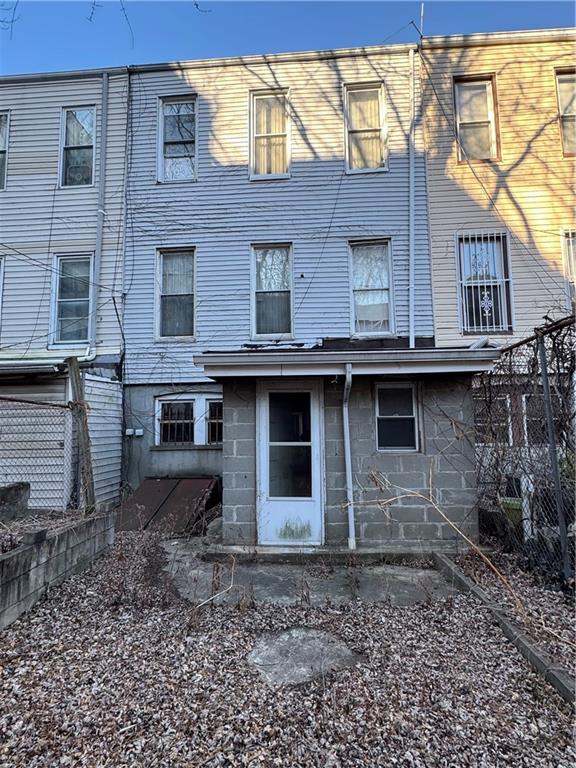 6 Pilling Street Brooklyn, NY 11207 - Photo 2 of 18 a view of a house with a yard and hanging chair
