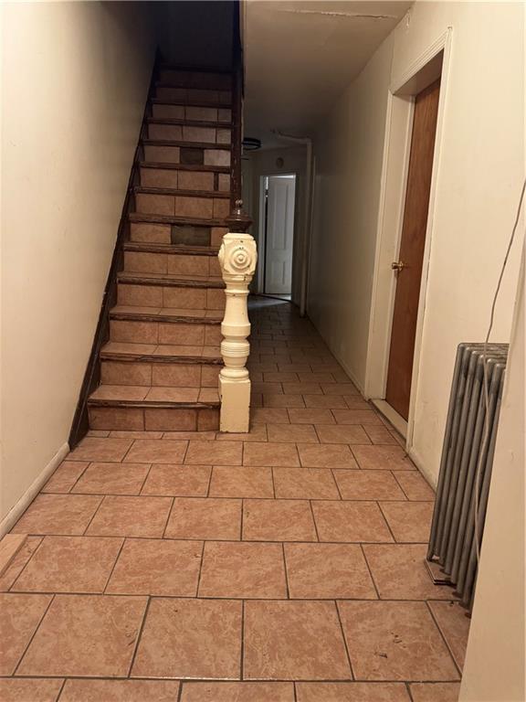 6 Pilling Street Brooklyn, NY 11207 - Photo 8 of 18 a view of a livingroom with wooden floor and stairs
