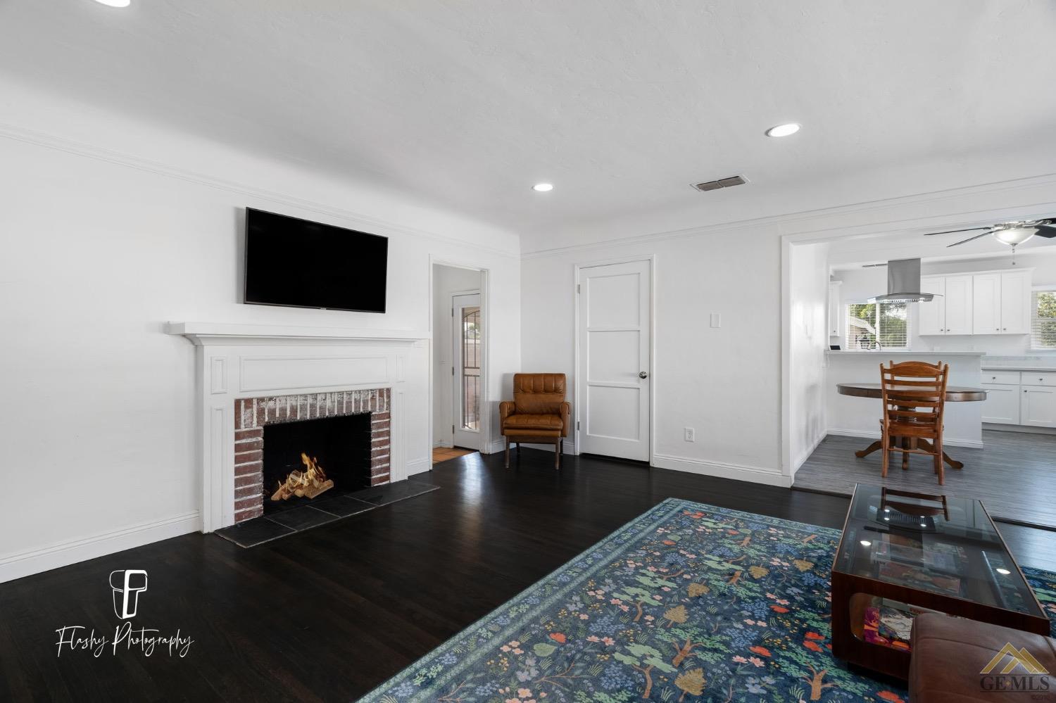 Undisclosed Address Bakersfield, CA 93305 - Photo 7 of 20 a living room with furniture and a fireplace