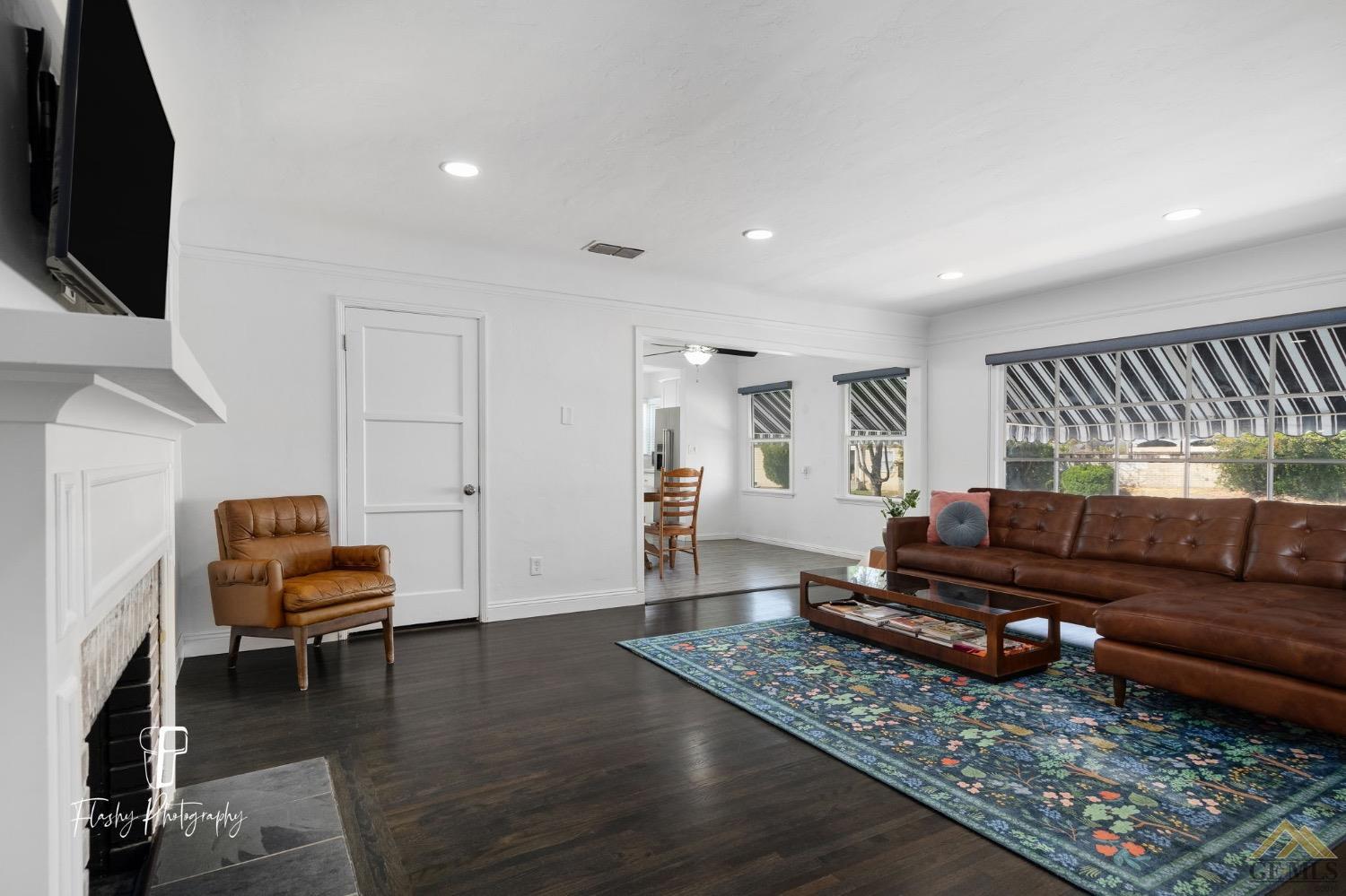 Undisclosed Address Bakersfield, CA 93305 - Photo 8 of 20 a living room with furniture and a flat screen tv