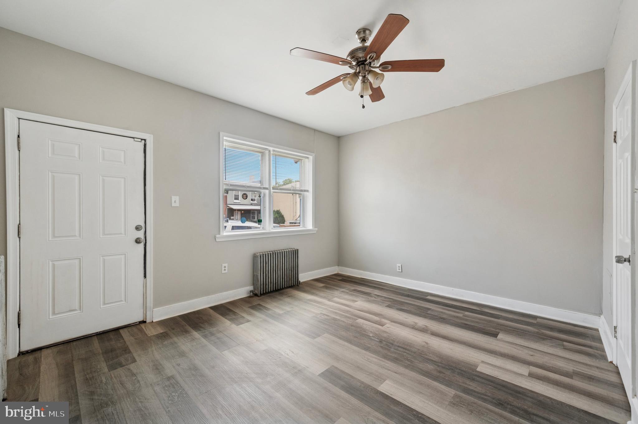 424 North 64th Street Philadelphia, PA 19151 - Photo 11 of 35 wooden floor in an empty room with a window