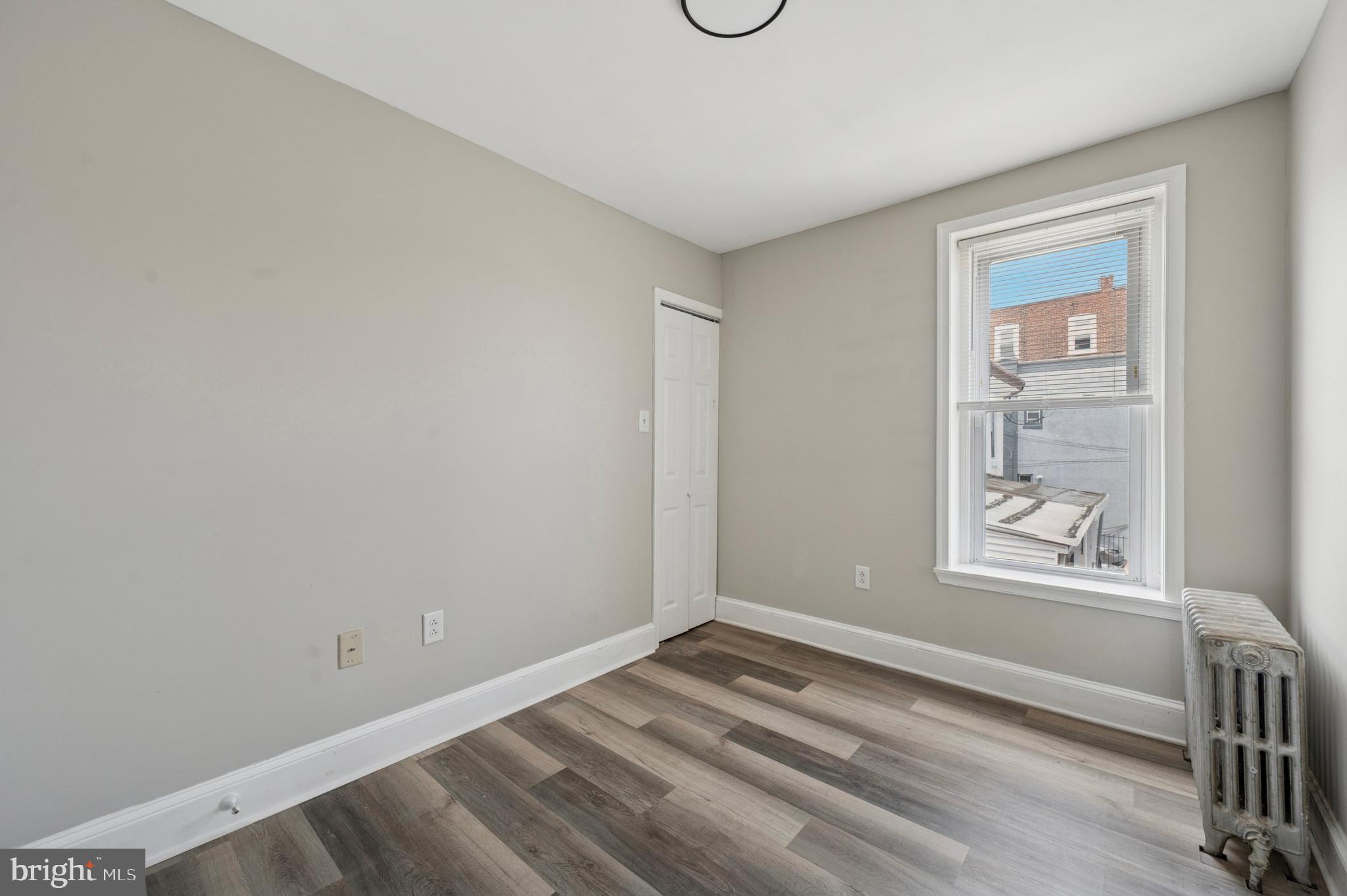 424 North 64th Street Philadelphia, PA 19151 - Photo 16 of 35 a view of empty room with window and wooden floor