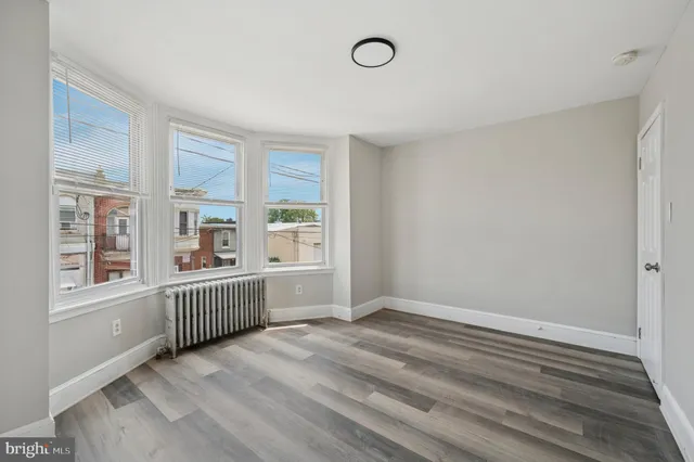 a kitchen with stainless steel appliances granite countertop a dining table chairs stove a sink and dishwasher