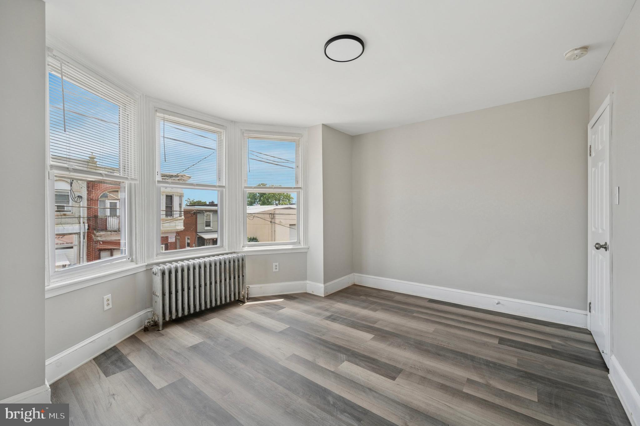 424 North 64th Street Philadelphia, PA 19151 - Photo 18 of 35 wooden floor in an empty room with a window