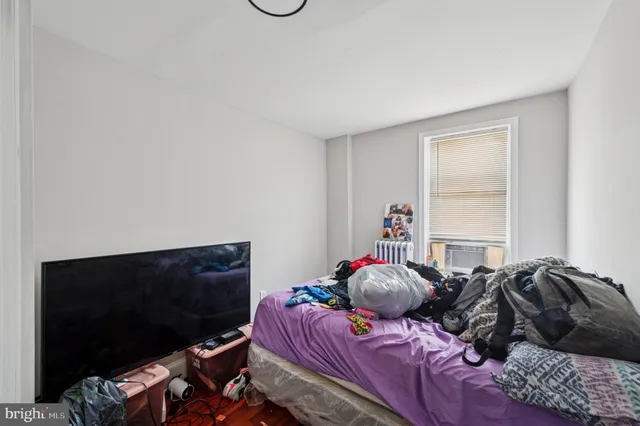 a bathroom with a sink a toilet and a shower