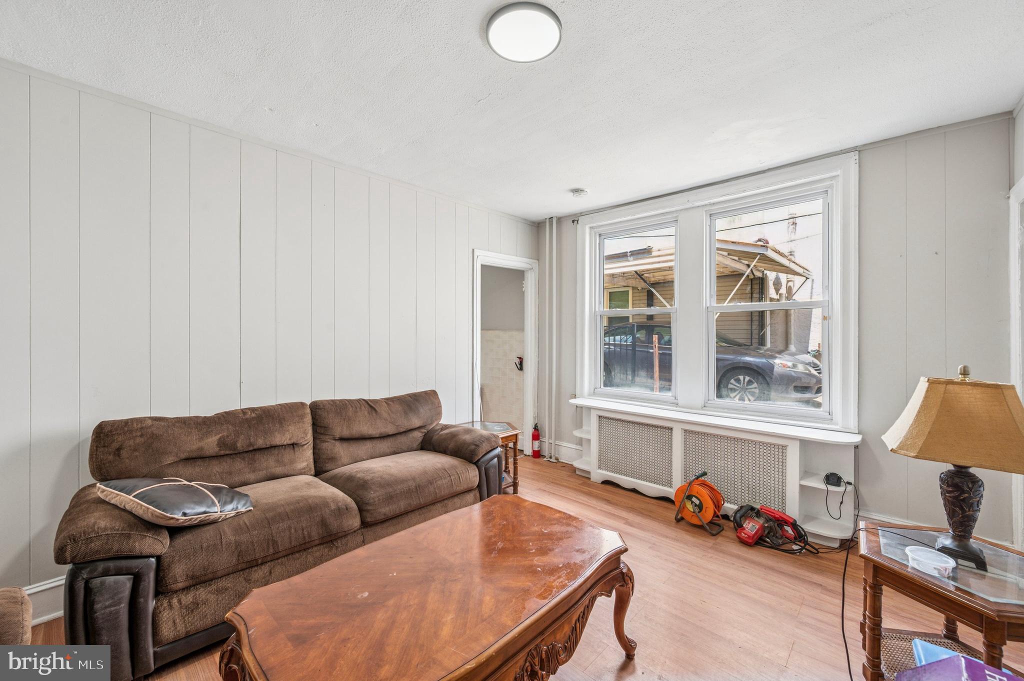 424 North 64th Street Philadelphia, PA 19151 - Photo 27 of 35 a living room with furniture a couch and a window