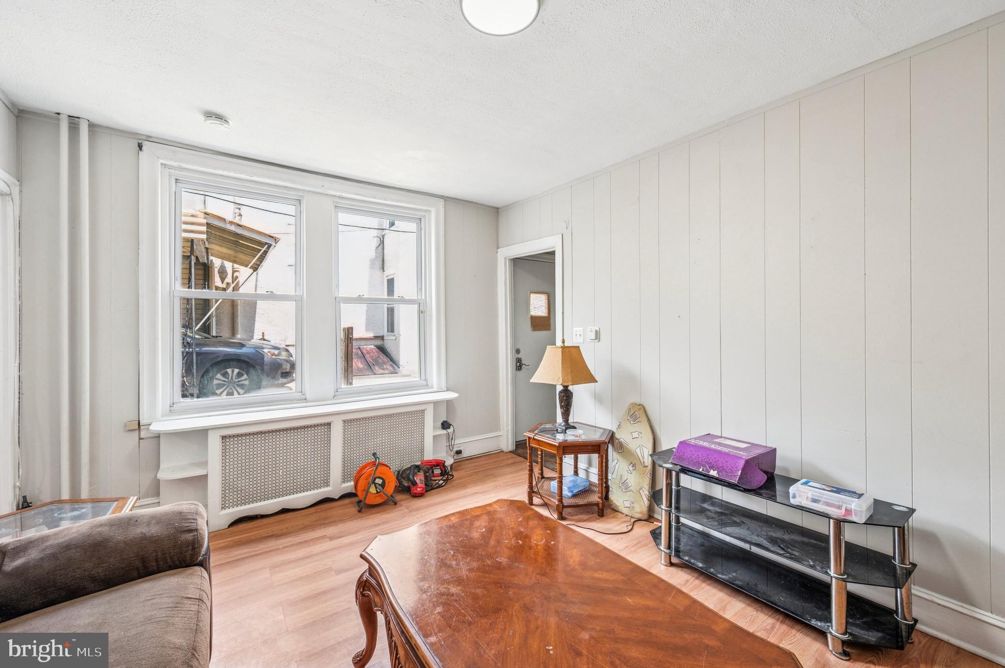 424 North 64th Street Philadelphia, PA 19151 - Photo 28 of 35 a living room with furniture a flat screen tv and a window