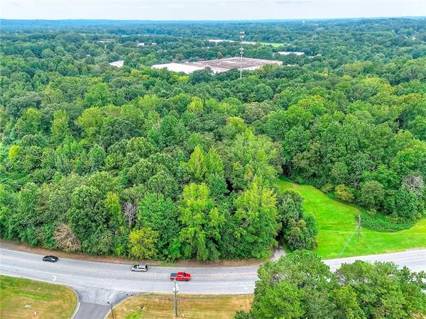 a view of a yard with potted plants
