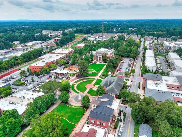 a view of a swimming pool and a yard
