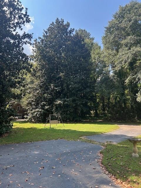 4349 Abbotts Bridge Road Duluth, GA 30097 - Photo 22 of 38 a view of a swimming pool and a yard