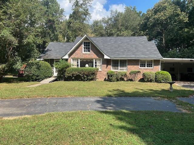 4349 Abbotts Bridge Road Duluth, GA 30097 - Photo 24 of 38 a front view of a house with a yard and garage