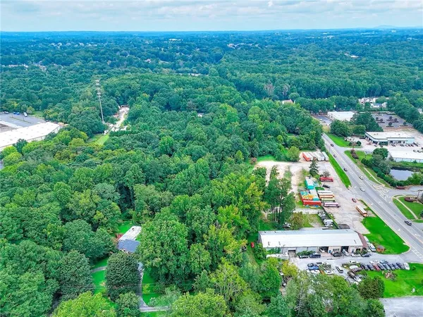 an aerial view of a house with lots of trees