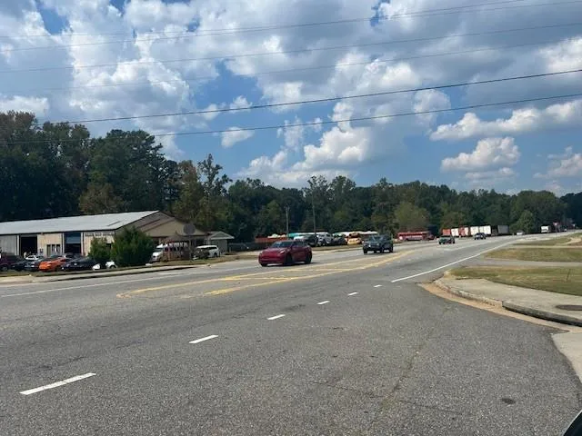 a view of a tree in the middle of a yard