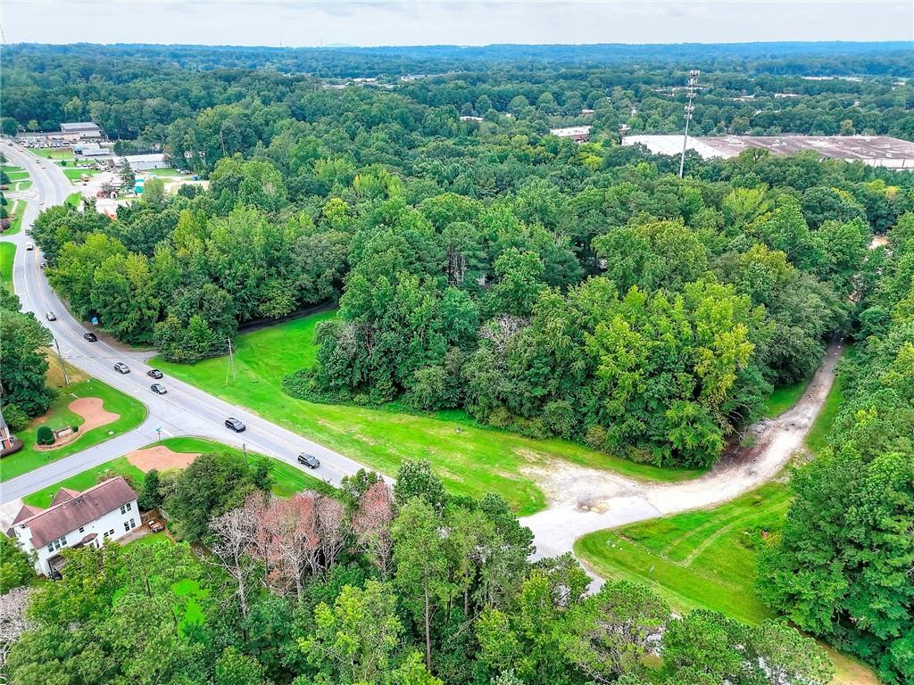4349 Abbotts Bridge Road Duluth, GA 30097 - Photo 10 of 38 a view of a garden with a building in the background
