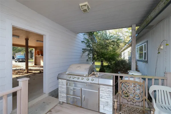 a view of balcony with wooden floor